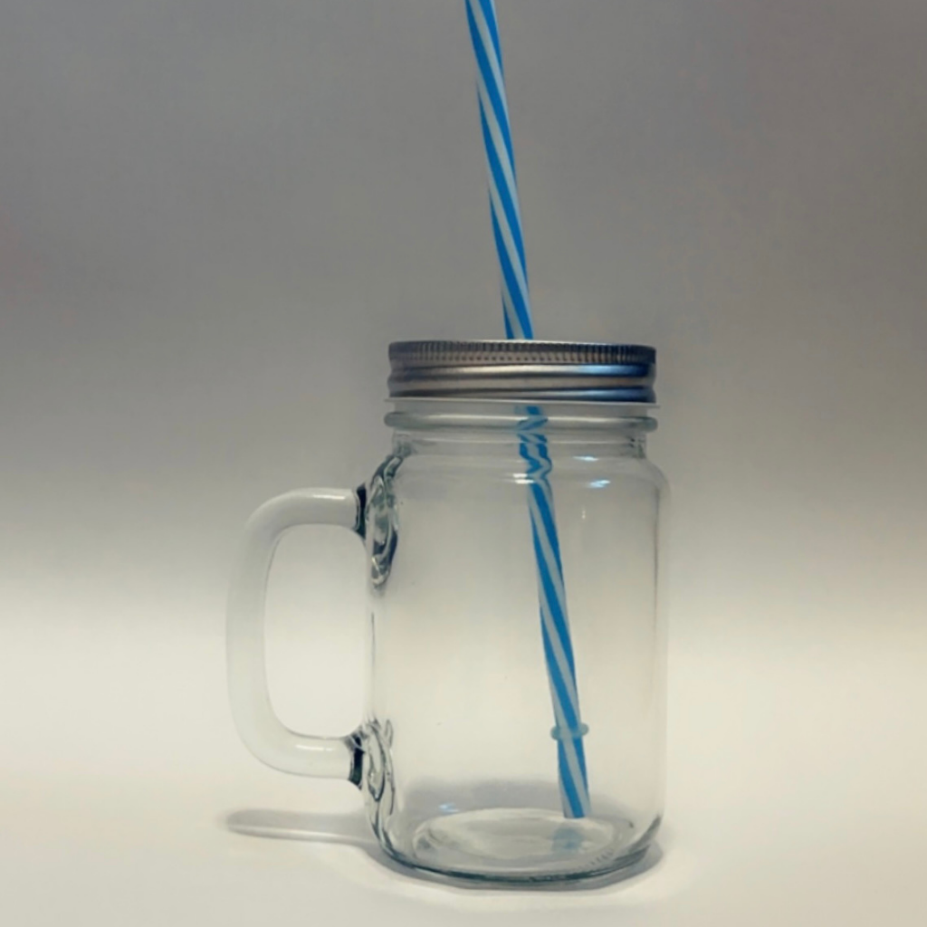 Glass drinking jar with lid and straw